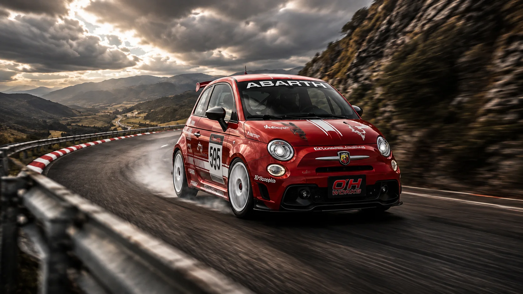 Red Abarth race car on a mountain road